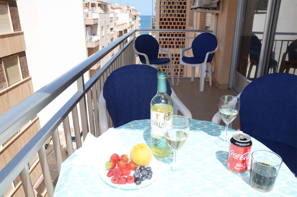 Drinks and fruit on the balcony table