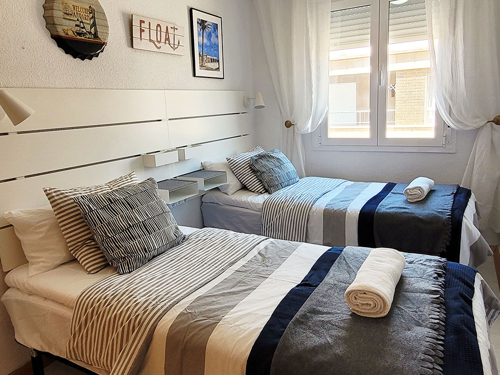 Bedroom with two single beds.